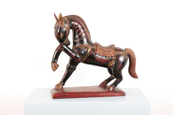 AN INDONESIAN POLYCHROME CARVED WOODEN HORSE