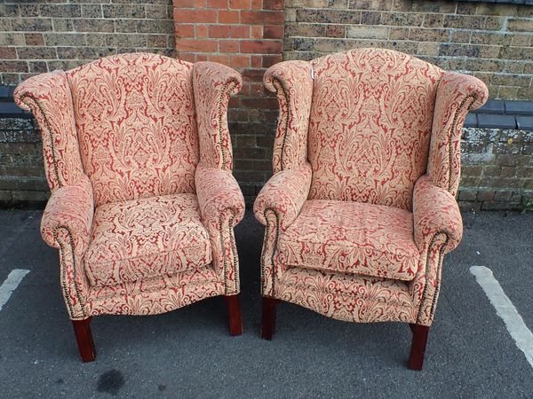 A PAIR OF WING BACK ARMCHAIRS