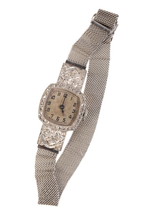 A LADY'S DIAMOND-SET & PLATINUM COCKTAIL WATCH