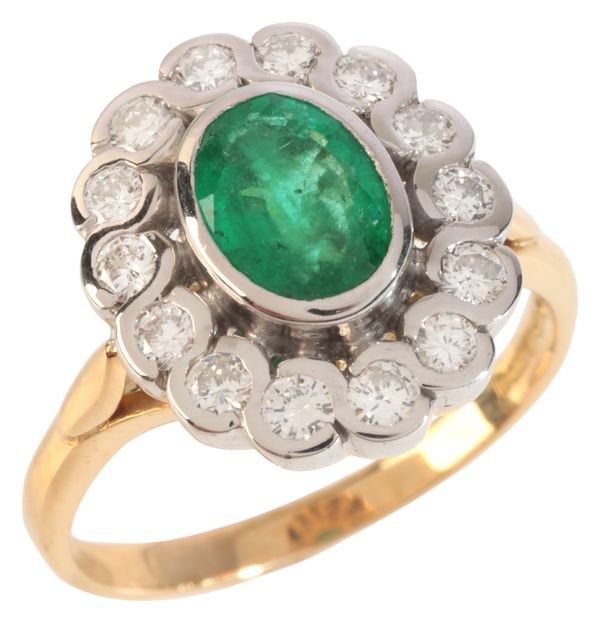 AN EMERALD AND DIAMOND CLUSTER RING