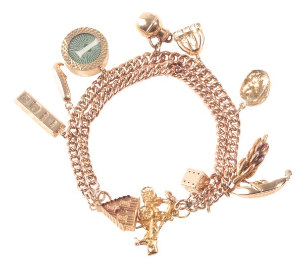 A 9CT GOLD CHARM BRACELET