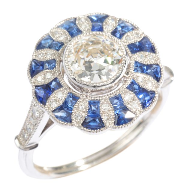A SAPPHIRE AND DIAMOND CLUSTER RING