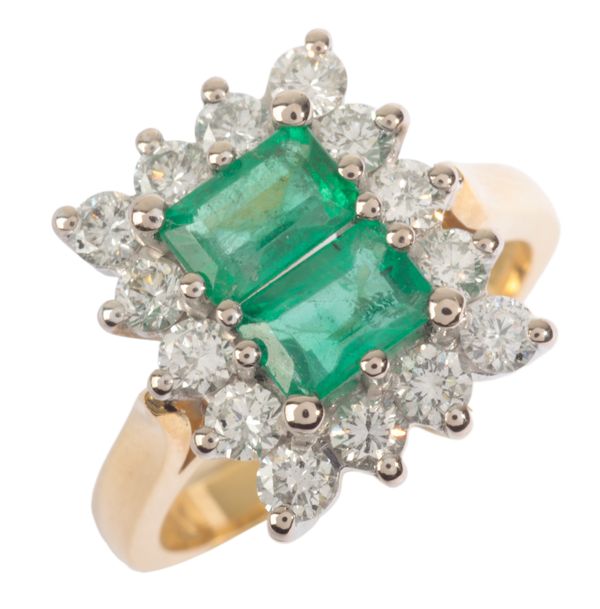 AN EMERALD AND DIAMOND CLUSTER RING