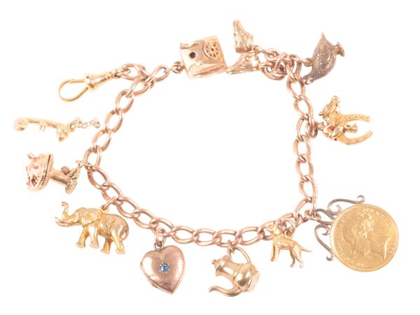 AN ANTIQUE 9CT GOLD CHARM BRACELET