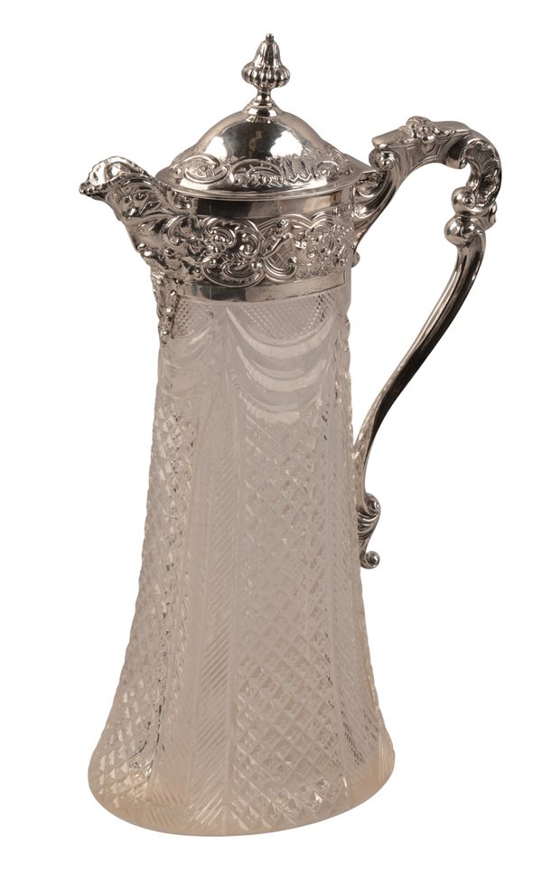 A LATE VICTORIAN SILVER MOUNTED CLARET JUG
