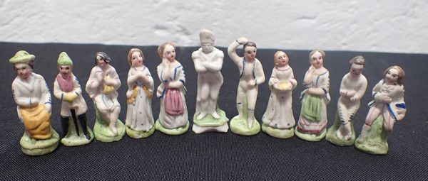 A SET OF VICTORIAN MINIATURE BISQUE FIGURES