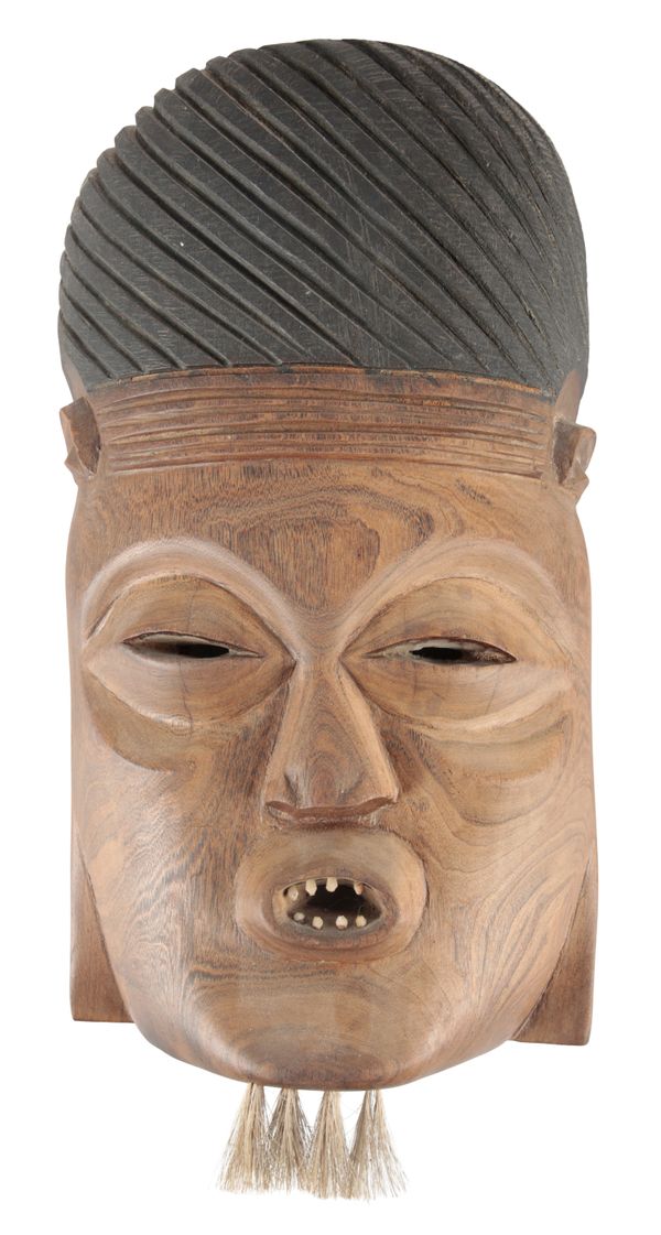 AN AFRICAN CARVED WOOD MASK
