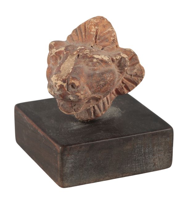 A ROMANO-EGYPTIAN TERRACOTTA LION'S HEAD FINIAL