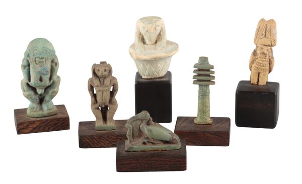 A GROUP OF SIX ANCIENT EGYPTIAN FAIENCE AMULETS
