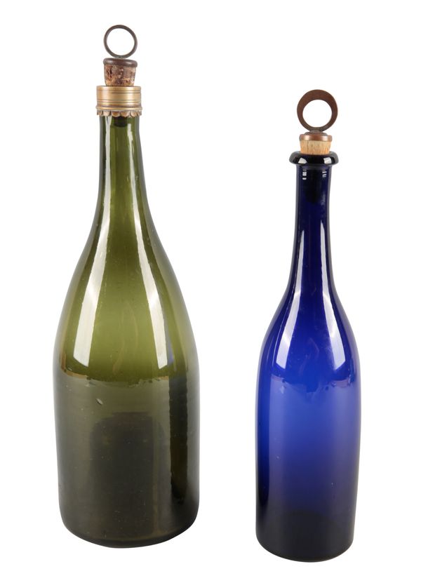 A BLUE GLASS BOTTLE DECANTER