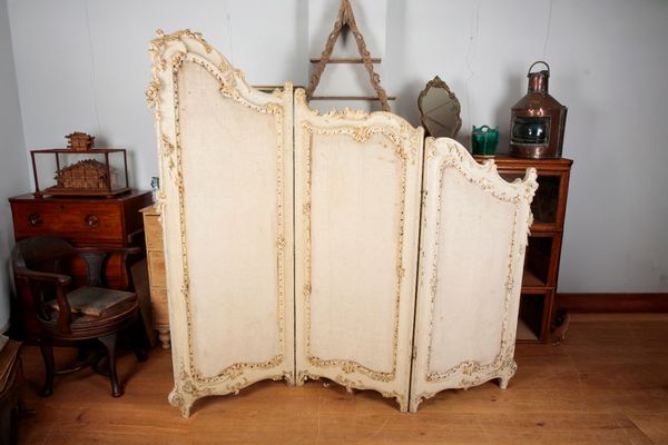 A GRADUATED FRENCH PAINTED SCREEN OR ROOM DIVIDER