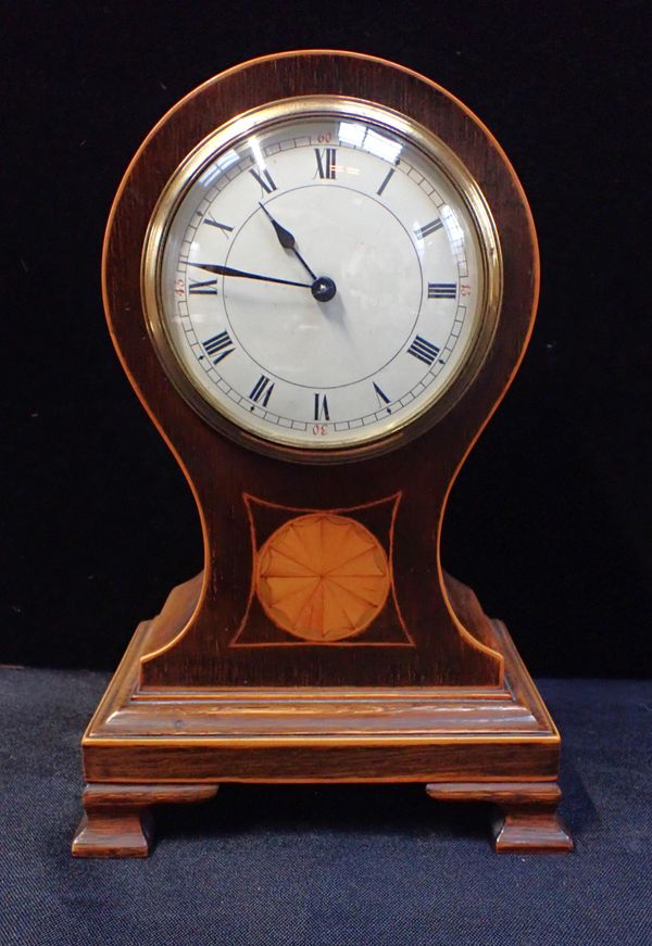 AN EDWARDIAN MAHOGANY 'BALLOON' CLOCK