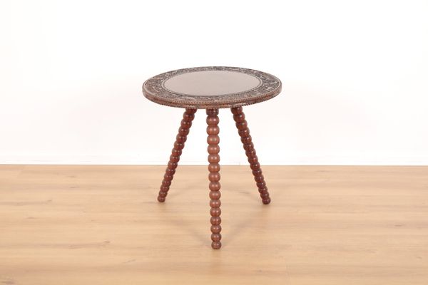 AN UNUSUAL BURMESE HARDWOOD OCCASIONAL TABLE