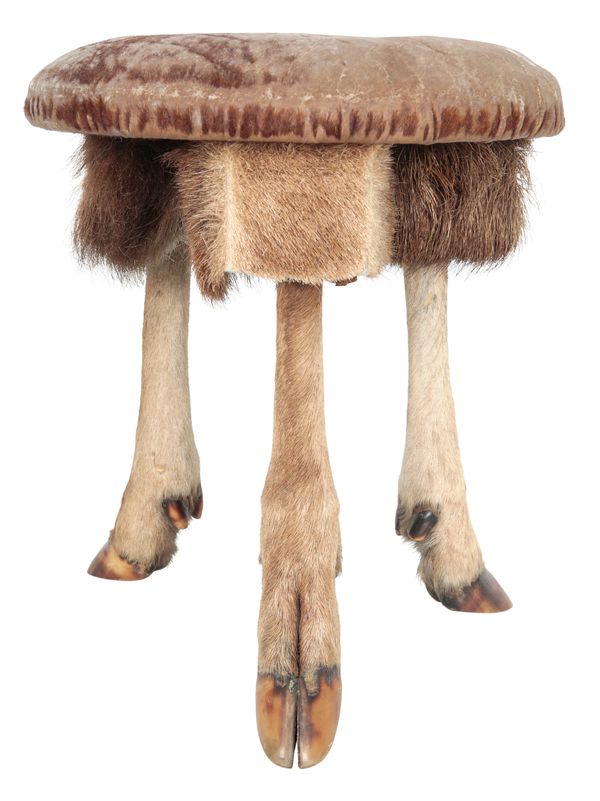 TAXIDERMY: A GOAT LEG CIRCULAR STOOL