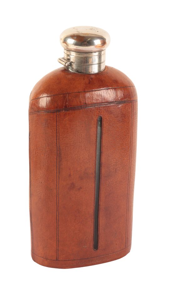 A LARGE EDWARDIAN SILVER-PLATED AND LEATHER-CLAD GLASS HIP FLASK