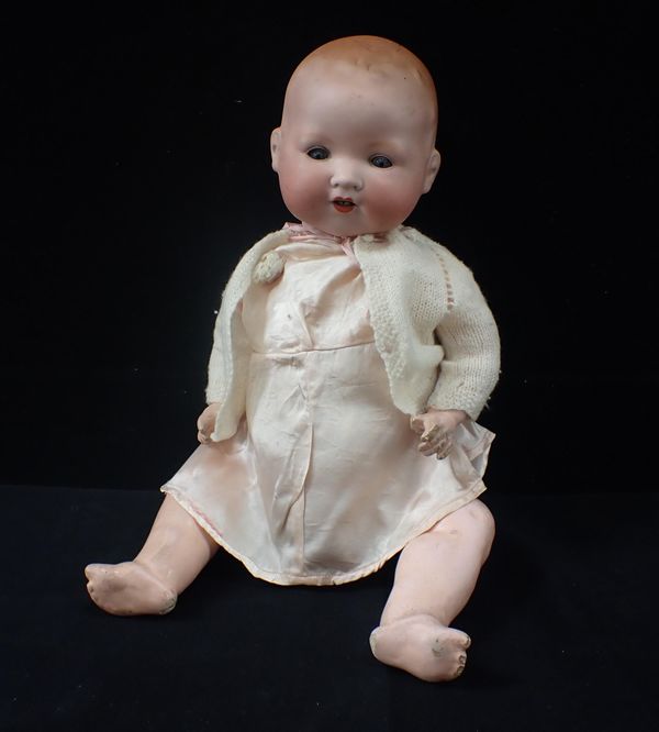 AN ARMAND MARSEILLES BISQUE HEAD DOLL