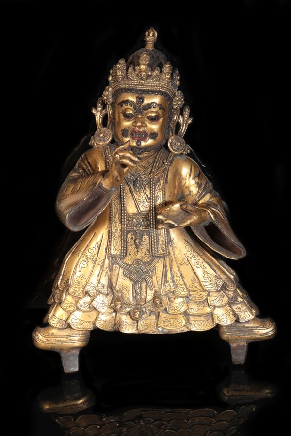 A TIBETAN GILT BRONZE FIGURE OF MAHAKALA