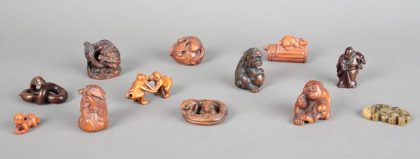 A COLLECTION OF ELEVEN JAPANESE CARVED WOOD NETSUKE