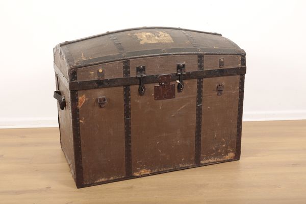 A DOMED TOP STEAMER TRUNK