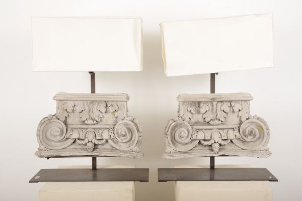 A PAIR OF PLASTER CORINTHIAN CAPITAL LAMPS WITH SHADES