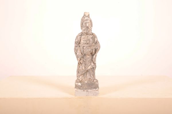 A PLASTER FIGURE OF BEARDED DEITY HOLDING A SICKLE