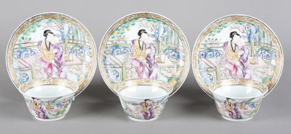 A SET OF THREE CHINESE PORCELAIN FAMILLE ROSE TEA BOWLS AND SAUCERS