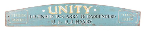 A WOOD ADVERTISING SIGN FOR THE VESSEL 'UNITY ' OWNED BY 'J.& R.J HAXBY'
