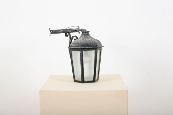 A BLACK WROUGHT IRON HEXAGONAL OUTDOOR LANTERN