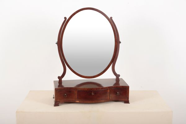 A GEORGE III MAHOGANY SERPENTINE FRONTED DRESSING MIRROR