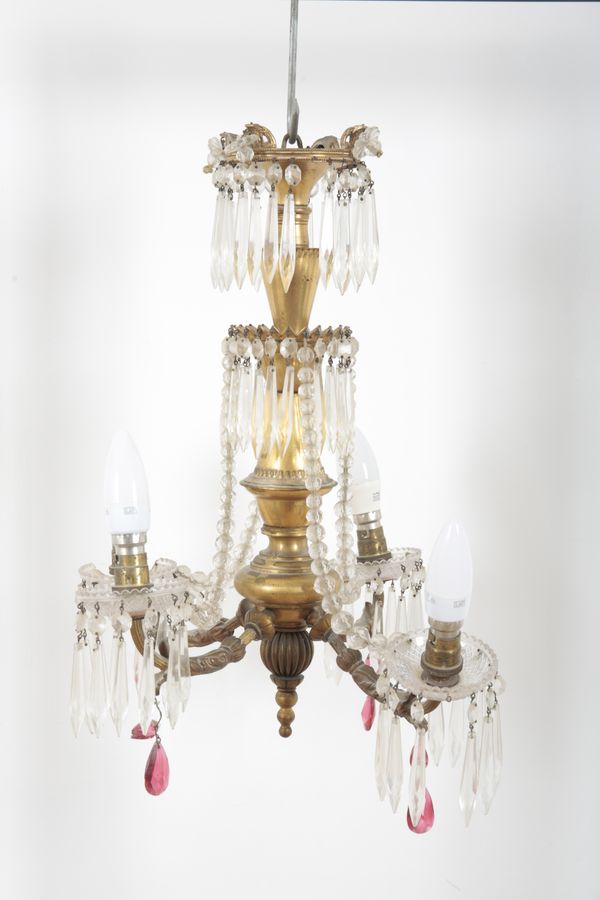 A GILT METAL AND CUT GLASS CHANDELIER