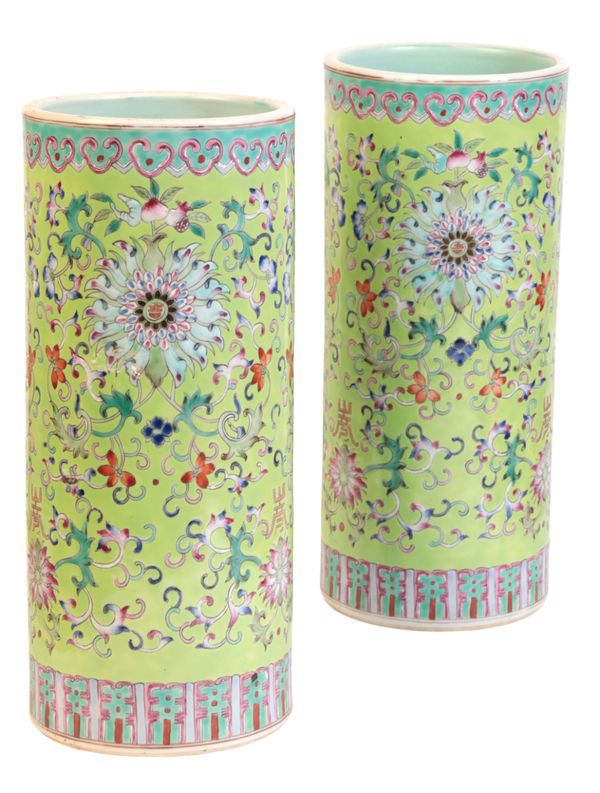 A PAIR OF CHINESE PORCELAIN GREEN GROUND FAMILLE ROSE SLEEVE VASES