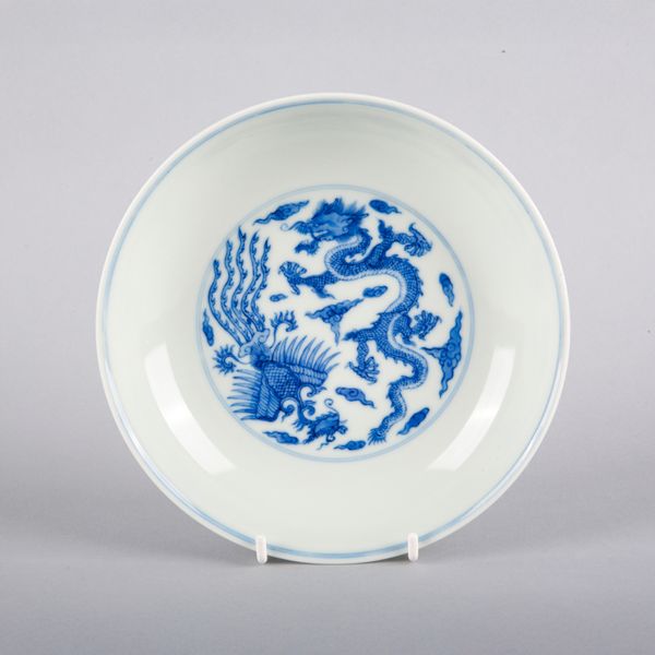 A CHINESE PORCELAIN BLUE AND WHITE 'DRAGON AND PHOENIX' DISH