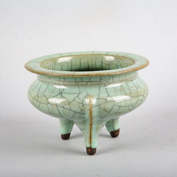 A CHINESE PORCELAIN CELADON TRIPOD CENSOR