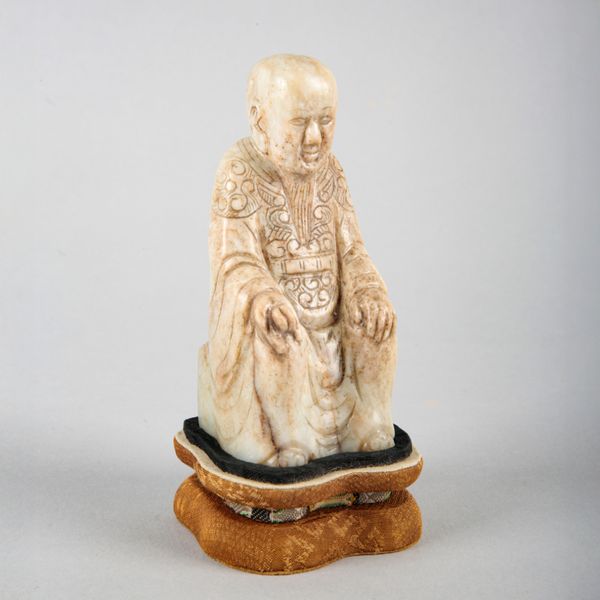 A CHINESE JADE FIGURE OF ZHENWU