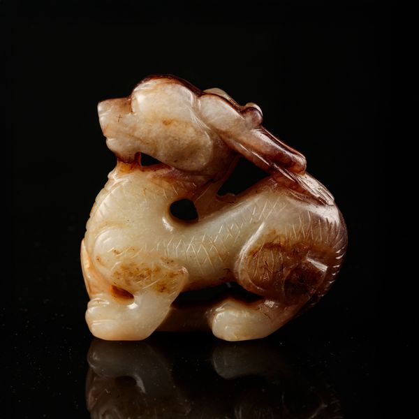 A CELADON JADE DRAGON