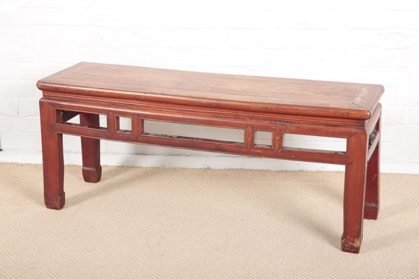 A CHINESE RED PAINTED ELM LOW RECTANGULAR TABLE