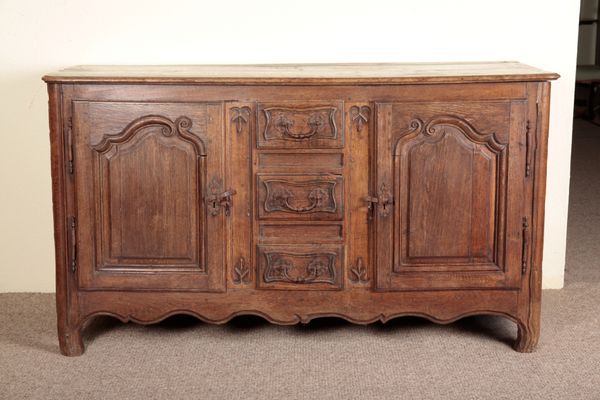 A FRENCH PROVINCIAL OAK DRESSER OR ENFILADE