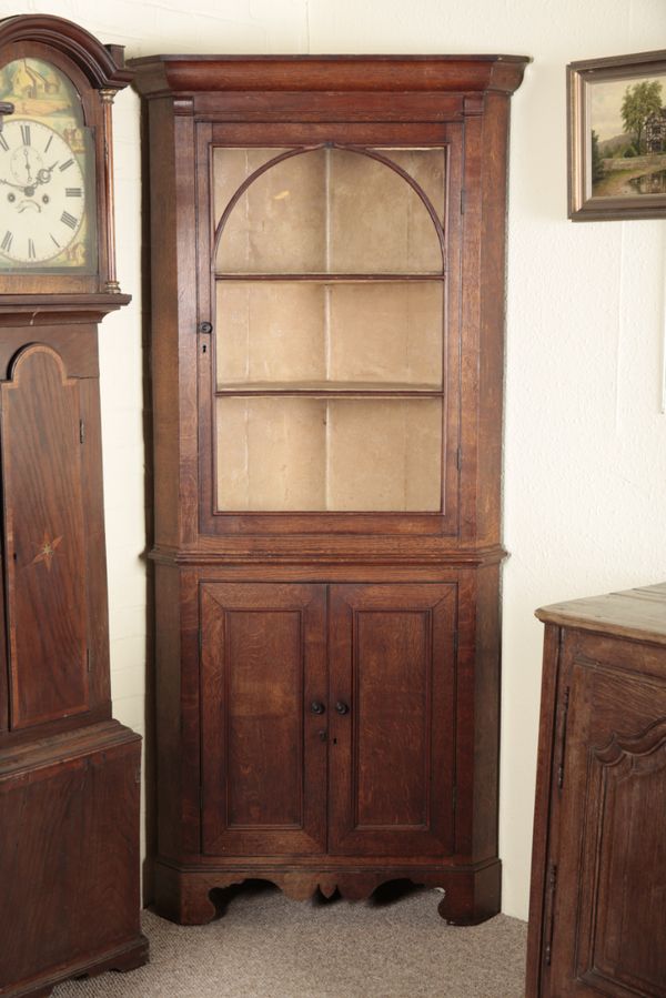 AN OAK CORNER CUPBOARD