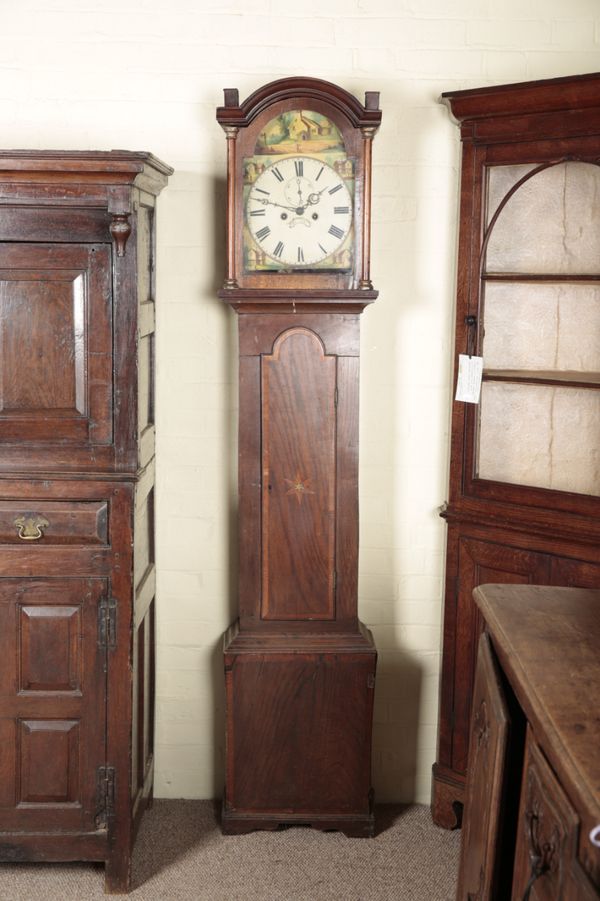 AN OAK LONGCASE CLOCK