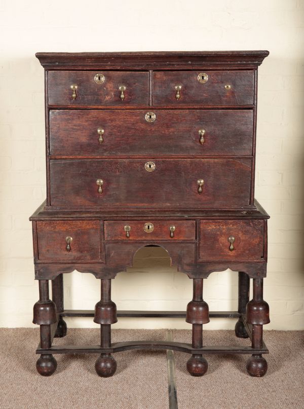 AN OAK CHEST ON STAND