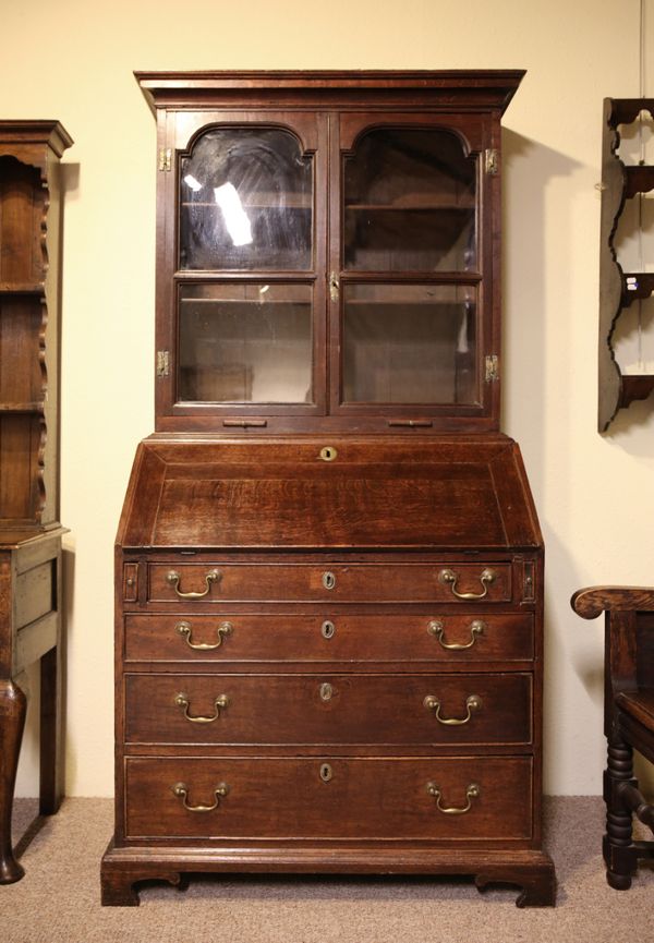 A GEORGE III OAK BOOKCASE SECRETAIRE