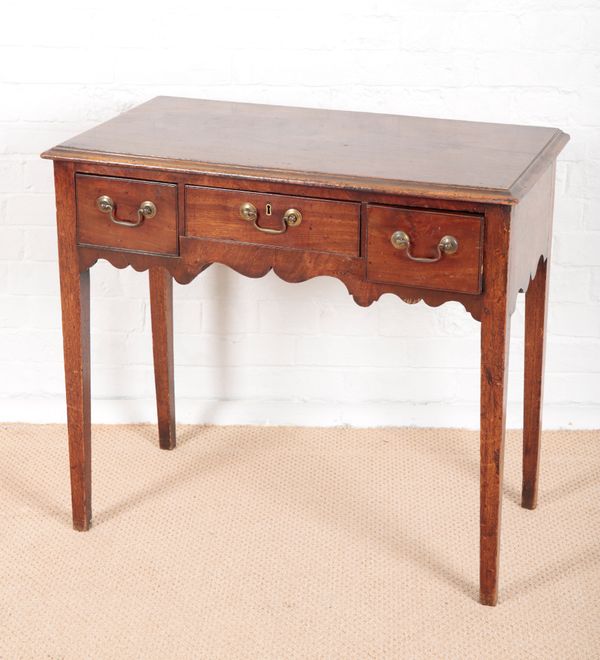 A GEORGE III MAHOGANY LOW BOY