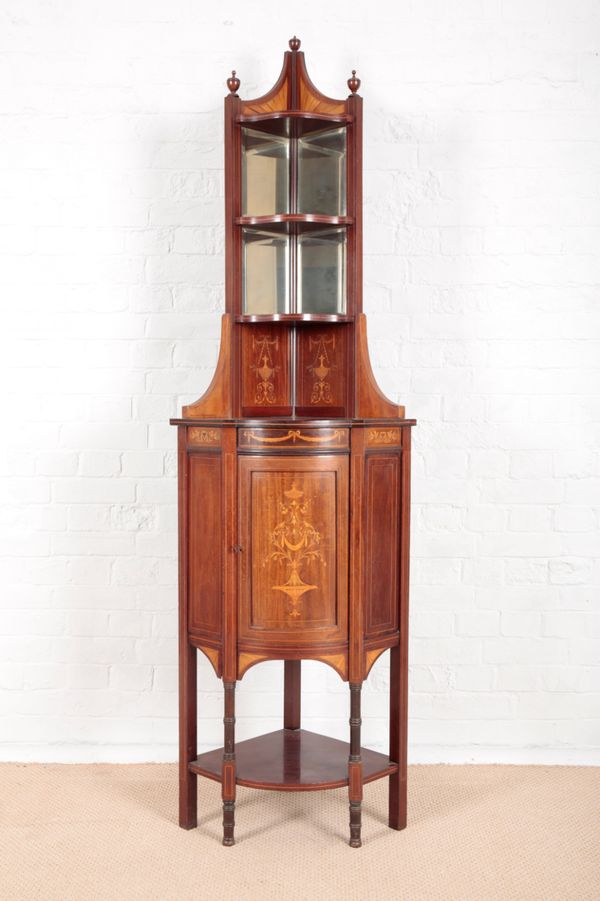 AN EDWARDIAN MAHOGANY CORNER STAND