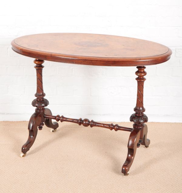 A VICTORIAN OVAL WALNUT CENTRE TABLE