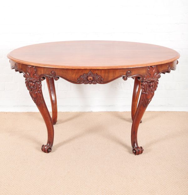 AN OVAL MAHOGANY CENTRE TABLE