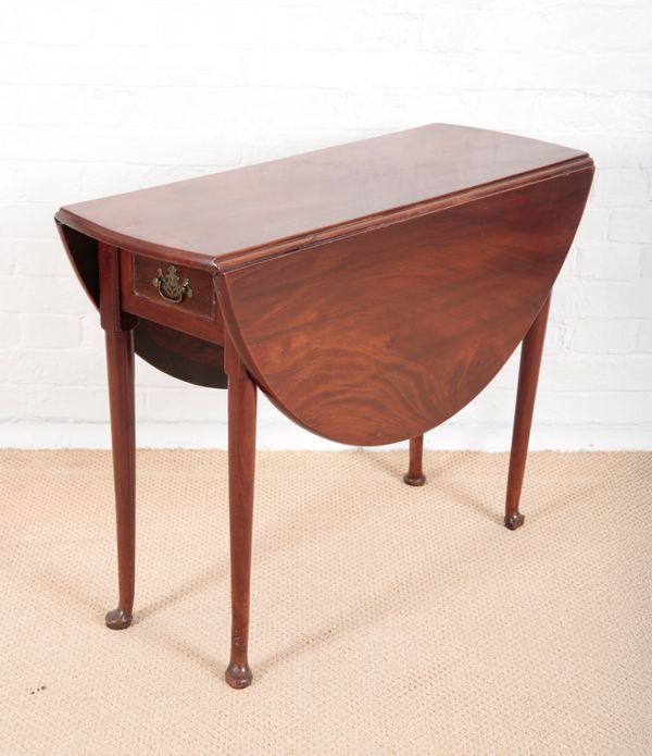 A GEORGE II MAHOGANY DROP-LEAF DINING TABLE