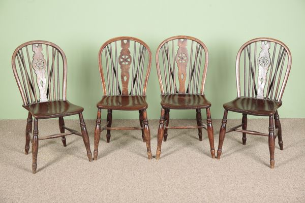 A SET OF FOUR ELM AND ASH WHEELBACK CHAIRS