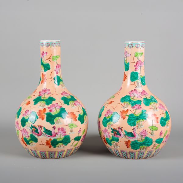 A PAIR OF CHINESE PORCELAIN FAMILLE ROSE BOTTLE VASES