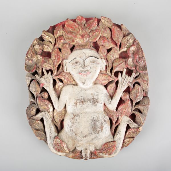 A SOUTH EAST ASIAN CARVED GLITWOOD AND POLYCHROME PANEL