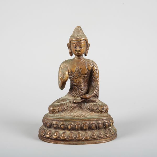 A SMALL SOUTH EAST ASIAN BRONZE BUDDHA
